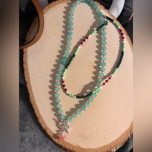 Elegant Beaded Necklace with Silver Charm